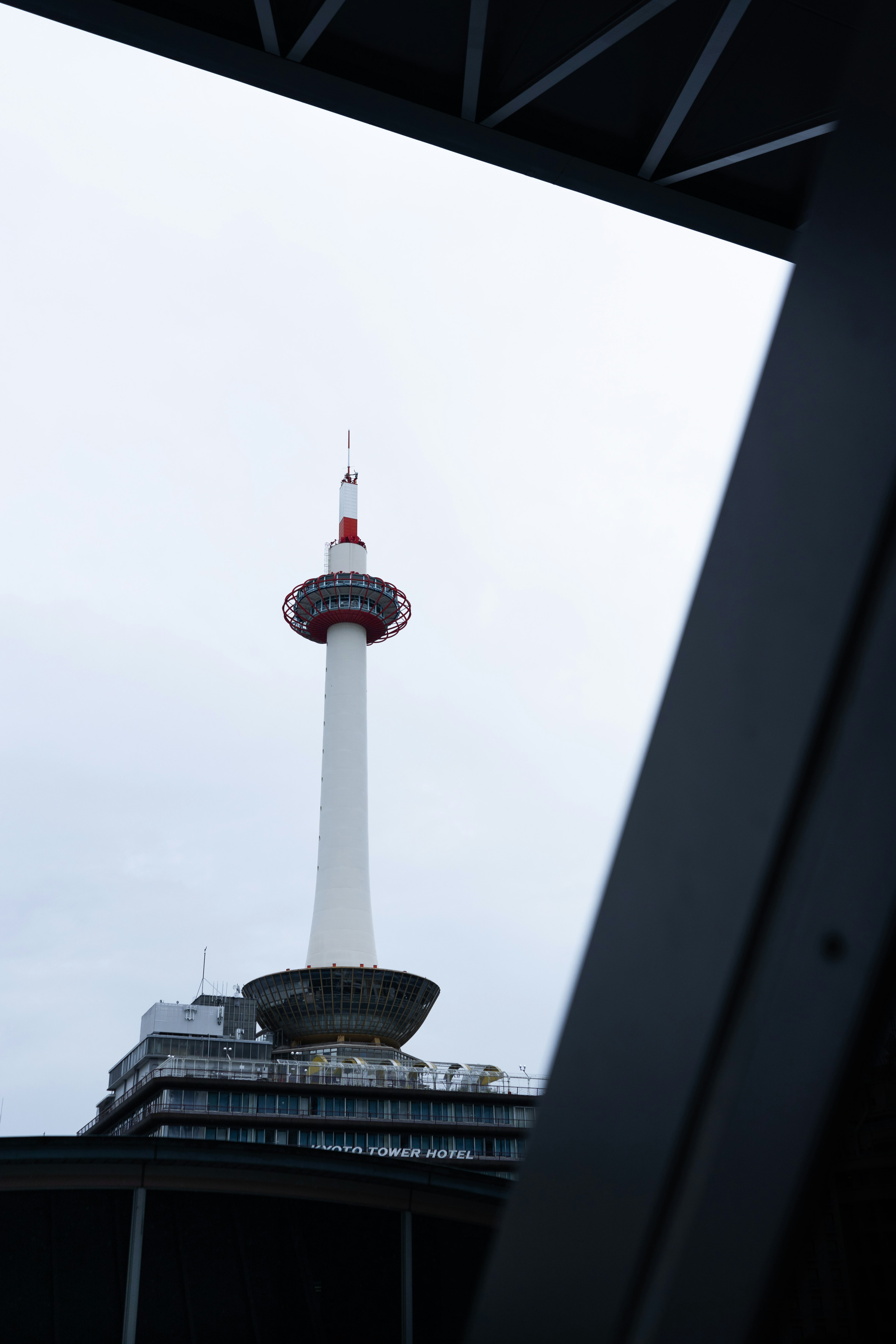 white and red tower under white sky during daytime